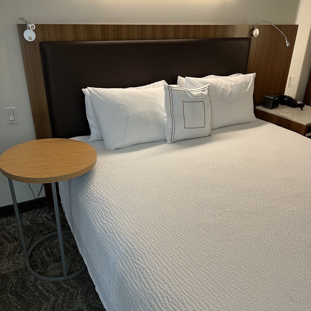 SpringHill Suites by Marriott Houston NASA/Seabrook - King size comfortable bed. Side table that slides slightly under the bed. - Hotels Near Me - Seabrook, Texas SpringHill Suites by Marriott Houston NASA/Seabrook - King size comfortable bed. Side table that slides slightly under the bed. - Hotels Near Me - Seabrook, Texas