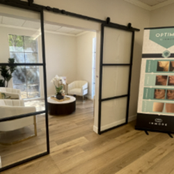 Encore Medspa - Waiting room with chairs, table and Optimas display