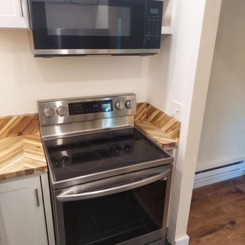AMS Renovations - Appliances suggested by stu. Venting microwave over stove freed up counter top space - Painters Near Me - Jamesport, New York