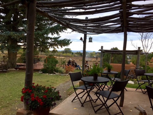 Photo of Old Taos Guesthouse Bed & Breakfast - Taos, NM, US. Outside patio behind the breakfast room - lovely to sit in the early morning and read with a cuppa Joe or tea.