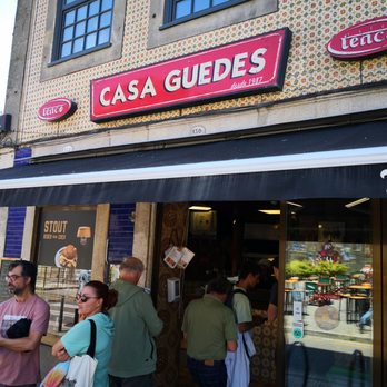 Casa Guedes - Casa Guedes original location exterior. Walk east past the new location to find this on the corner. - Portuguese Near Me - Porto, 13 Casa Guedes - Casa Guedes original location exterior. Walk east past the new location to find this on the corner. - Portuguese Near Me - Porto, 13