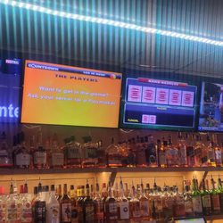Locals Pub - 8 beautiful TVs all in a row. Buzztime trivia and poker running all day.