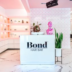 Bond Hair Bar - Welcoming reception space with curated haircare products.