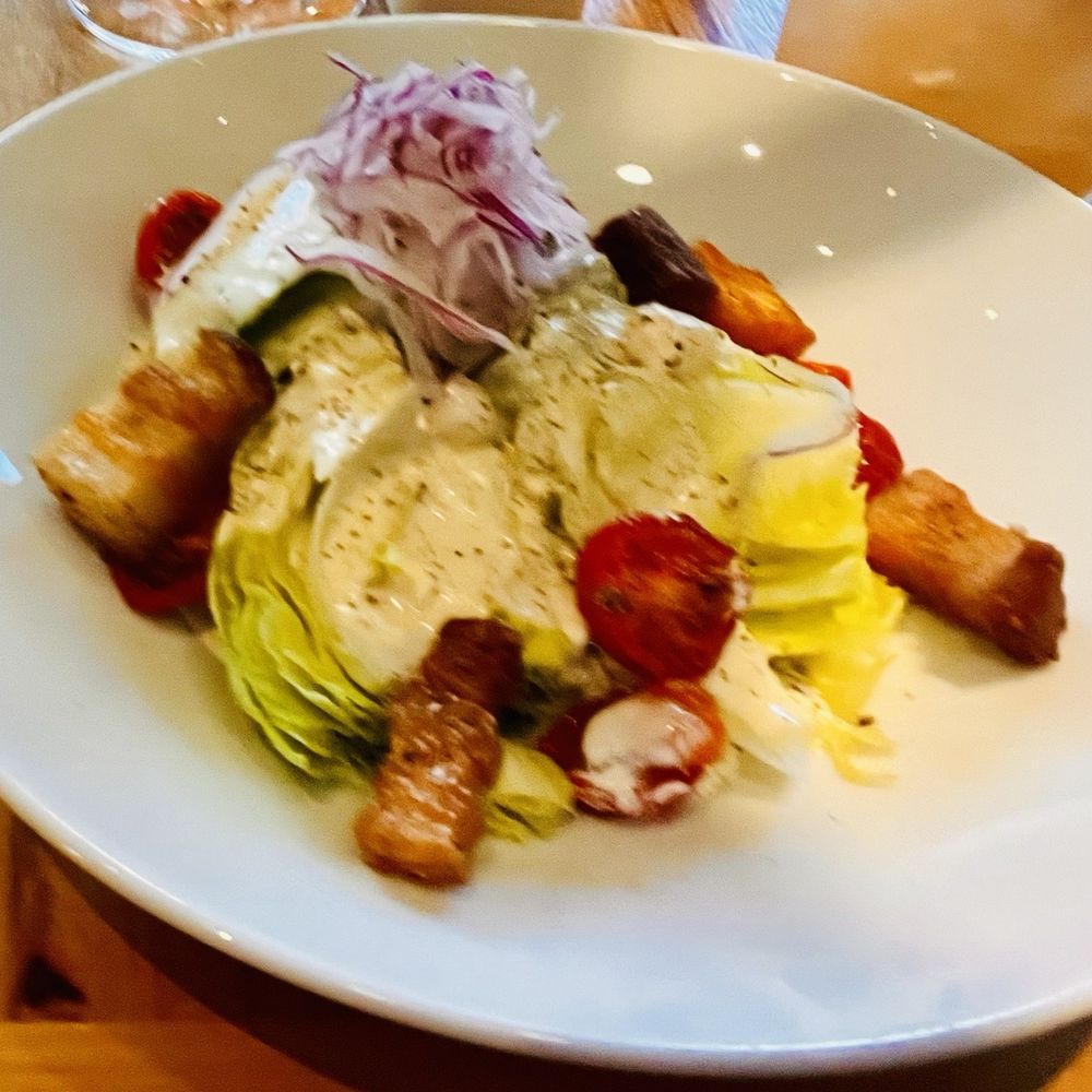 Bos Taurus - BOS wedge: wilted heirloom tomatoes, Red onion, Crispy pork, Smokey Bleu Cheese Mmmmm - Steakhouses Near Me - Bend, Oregon Bos Taurus - BOS wedge: wilted heirloom tomatoes, Red onion, Crispy pork, Smokey Bleu Cheese Mmmmm - Steakhouses Near Me - Bend, Oregon