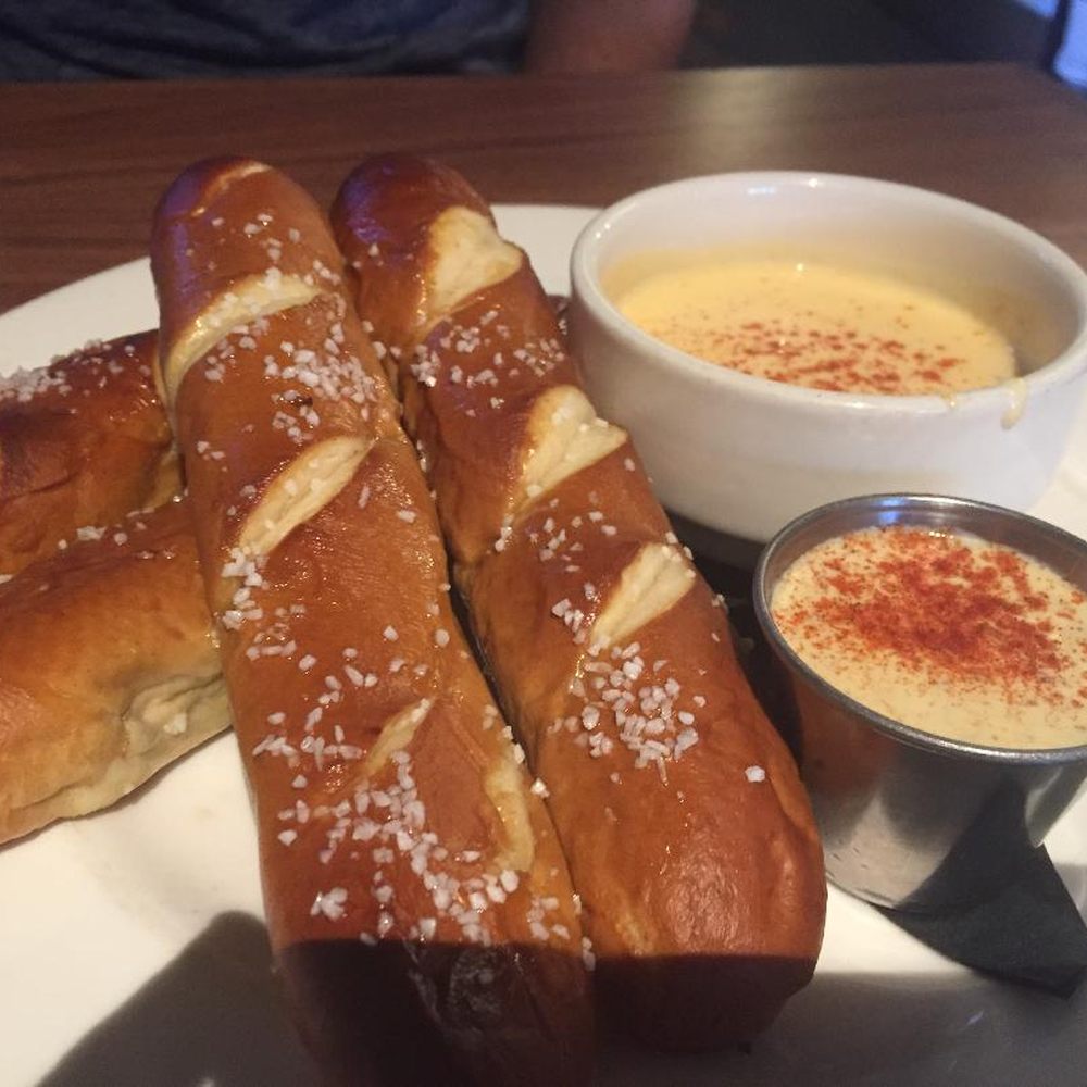 Benson Brewery - Pretzel sticks with cheese sauce (top) and IPA mustard - one of the best apps available in Omaha. Both dipping sauces are top of the line. - Gastropubs Near Me - Omaha, Nebraska Benson Brewery - Pretzel sticks with cheese sauce (top) and IPA mustard - one of the best apps available in Omaha. Both dipping sauces are top of the line. - Gastropubs Near Me - Omaha, Nebraska