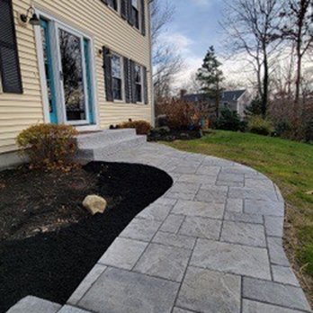 Lawrence Landscaping and Son - a paver walkway in front of a house - Landscaping Near Me - Plymouth, Massachusetts Lawrence Landscaping and Son - a paver walkway in front of a house - Landscaping Near Me - Plymouth, Massachusetts