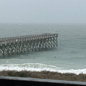 Surf Suites - Surfer in the freezing rain. Interesting to watch. - Hotels Near Me - Wrightsville Beach, North Carolina Surf Suites - Surfer in the freezing rain. Interesting to watch. - Hotels Near Me - Wrightsville Beach, North Carolina