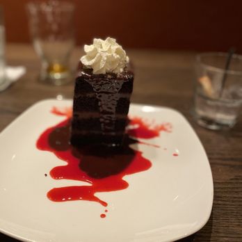 Burtons Grill & Bar - a piece of chocolate cake on a plate - New American Near Me - Charlottesville, Virginia