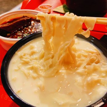 Chef Rong Noodle House - noodles being lifted by chopsticks - Chinese Near Me - Burnaby, British Columbia