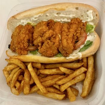 NOLA Seafood & Spirits - freshly-fried Catfish Po' Boy, lettuce and tomato, lightly-spicy mayo-butter sauce on fresh French Bread, with a side of tasty fries - Seafood Near Me - Baltimore, Maryland NOLA Seafood & Spirits - freshly-fried Catfish Po' Boy, lettuce and tomato, lightly-spicy mayo-butter sauce on fresh French Bread, with a side of tasty fries - Seafood Near Me - Baltimore, Maryland