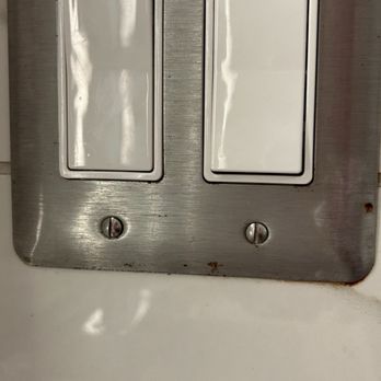 Weber's Boutique Hotel  - In the bathroom they chose metal plated switch cover- shows it's starting to rust- likely due to moisture of bathroom. - Hotels Near Me - Ann Arbor, Michigan