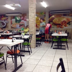 Cenoura Pastéis - Inside seating area.  Large open space with Windows opening on one side to give you an awesome outside experience