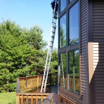 Vertigo Window Cleaning - Monica reaching the high windows in beautiful Boyne City. Call Michael or Monica today to schedule a free estimate. 231-675-8880 - Window Washing Near Me - Ellsworth, Michigan Vertigo Window Cleaning - Monica reaching the high windows in beautiful Boyne City. Call Michael or Monica today to schedule a free estimate. 231-675-8880 - Window Washing Near Me - Ellsworth, Michigan
