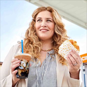 Circle K - a woman holding two doughnuts and a drink - Convenience Stores Near Me - Indianapolis, Indiana Circle K - a woman holding two doughnuts and a drink - Convenience Stores Near Me - Indianapolis, Indiana