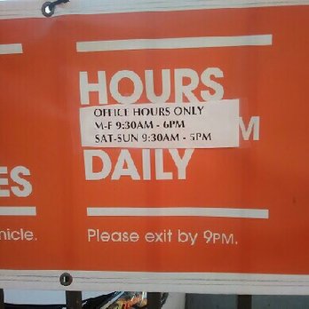 Public Storage - Sign shows office hours and says to "Please exit by 9 p.m." - Self Storage Near Me - Huntington Beach, California