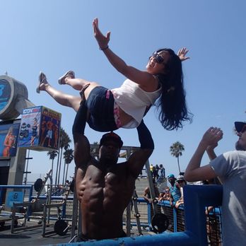 Venice Statepark - 2017-09-01. Muscle Beach, Venice, CA. A "Defender" warming up with the crowd prior to live filming of What the Fit with guest James Corden. - Beaches Near Me - Venice, California Venice Statepark - 2017-09-01. Muscle Beach, Venice, CA. A "Defender" warming up with the crowd prior to live filming of What the Fit with guest James Corden. - Beaches Near Me - Venice, California