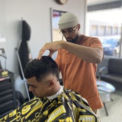 The Garage Barbershop - Chris cutting