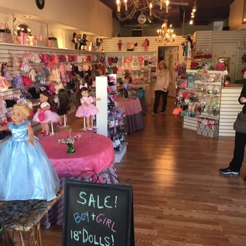 Doll Clothes Factory - Interior, lots of different dresses and costumes along with shoes for them. - Toy Stores Near Me - Hendersonville, North Carolina