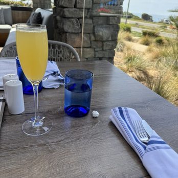 Chandler's Oceanfront Dining - Mimosa outside on the patio - New American Near Me - Carlsbad, California Chandler's Oceanfront Dining - Mimosa outside on the patio - New American Near Me - Carlsbad, California