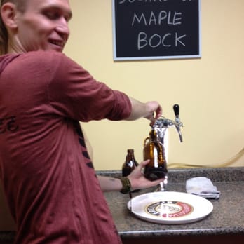 Glass Half Full - Ryan pouring the perfect Growler - Beer, Wine & Spirits Near Me - Oakville, Ontario