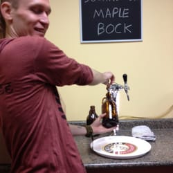 Glass Half Full - Ryan pouring the perfect Growler