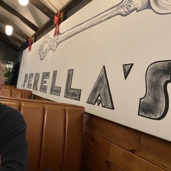 Perella's Ristorante - a man sitting at a table - Pizza Near Me - Warren, Rhode Island