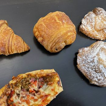 Arsicault - (Clockwise) Croissant, Chocolate Croissant, Almond Croissant, Chocolate Almond Croissant and Bacon Garlic Galette from Arsicault. - Bakeries Near Me - San Francisco, California Arsicault - (Clockwise) Croissant, Chocolate Croissant, Almond Croissant, Chocolate Almond Croissant and Bacon Garlic Galette from Arsicault. - Bakeries Near Me - San Francisco, California