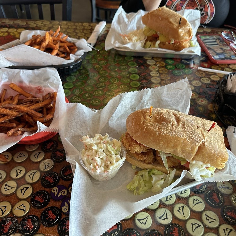Brewhouse 100 - Shrimp Po' Boy and sweet potato fries. That's the large sandwich shared. - Southern Near Me - Nashville, Tennessee