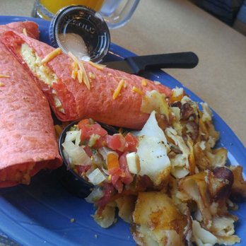 Mel's Diner - Egg burrito on a tomato wrap with roasted shredded potatoes on the side - Diners Near Me - Naples, Florida Mel's Diner - Egg burrito on a tomato wrap with roasted shredded potatoes on the side - Diners Near Me - Naples, Florida
