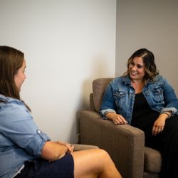 Raft Counseling - Kristy and Amanda connect at a team meeting