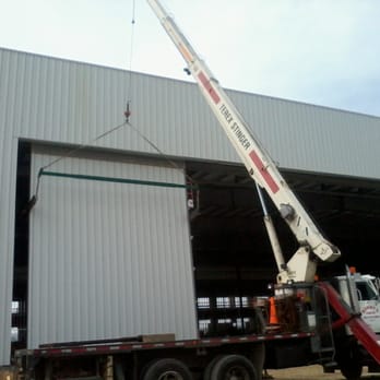 Sonny's Crane - Hoisting Hanger Doors at Calgary International Airport - Crane Services Near Me - Balzac, Alberta