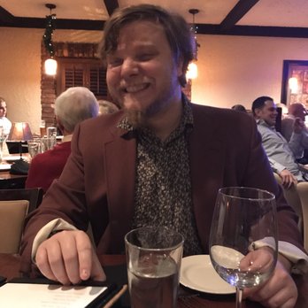 Cork N' Cleaver - I told him he looked like an 80s con man with a heart of gold. Tbh his outfit wasn't out of place with the retro decor of the restaurant. - Steakhouses Near Me - Fort Wayne, Indiana