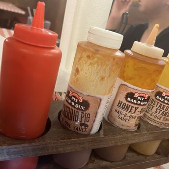 Bennett's Pit Bar-B-Que - Bbq sauce selection on each table - Barbeque Near Me - Gatlinburg, Tennessee