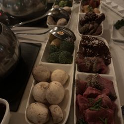 The Melting Pot - One steak entrée and one original entrée.