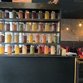 Farmer's Grandson EATERY - Canning wall and sitting area - American Near Me - Eagan, Minnesota