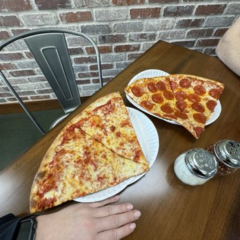 Antonio's Pizzeria - Example of size next to my hand. - Pizza Near Me - North Charleston, South Carolina Antonio's Pizzeria - Example of size next to my hand. - Pizza Near Me - North Charleston, South Carolina