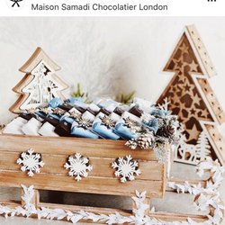 Maison Samadi - Maison Samadi white Christmas Sleigh with selection of products