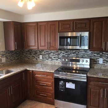 Dj Construction LLC - a kitchen with stainless steel appliances - Plumbing Near Me Dj Construction LLC - a kitchen with stainless steel appliances - Plumbing Near Me