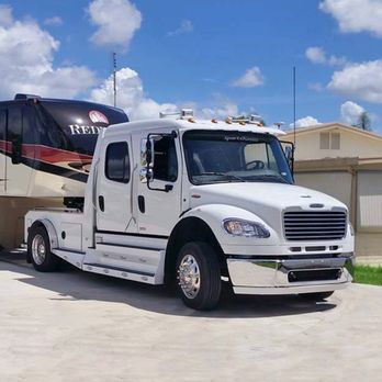 Sportchassis - a white truck with a trailer attached - General Contractors Near Me - Clinton, Oklahoma Sportchassis - a white truck with a trailer attached - General Contractors Near Me - Clinton, Oklahoma