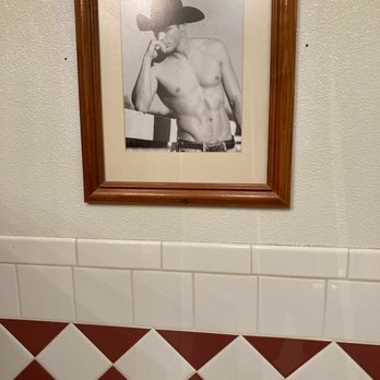 Ost Restaurant - Beefcake in women's bathroom. - American Near Me - Bandera, Texas