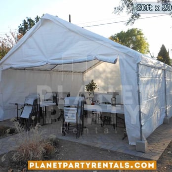 Planet Party Rentals - 20ft x 20ft tent with sidewalls and rectangular tables and white plastic chairs - Party Equipment Rentals Near Me