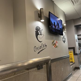 Never On Sunday - a tv mounted on the wall of a restaurant - Greek Near Me - Baltimore, Maryland Never On Sunday - a tv mounted on the wall of a restaurant - Greek Near Me - Baltimore, Maryland