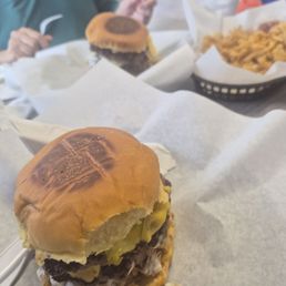 The loaded burger up front, onion stack and mushroom Swiss in back The loaded burger up front, onion stack and mushroom Swiss in back