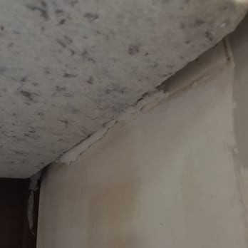 Stone Center - This shows a 1-inch gap between the granite and kitchen wall - Kitchen & Bath Near Me - Lakeland, Florida Stone Center - This shows a 1-inch gap between the granite and kitchen wall - Kitchen & Bath Near Me - Lakeland, Florida