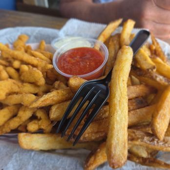 The Boardwalk Grill - Yummy Clam Strip Basket with excellent fries. - Seafood Near Me - Madeira Beach, Florida The Boardwalk Grill - Yummy Clam Strip Basket with excellent fries. - Seafood Near Me - Madeira Beach, Florida