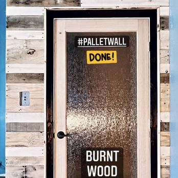 Smoke and Ashes Design - Palletwood Feature Wall with Burnt Wood Trim. - Carpenters Near Me