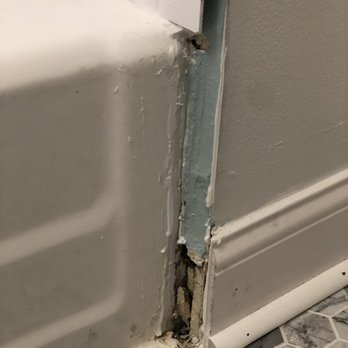 Bath Fitter - the corner of a bathtub with a hole in it - Kitchen & Bath Near Me - Lombard, Illinois