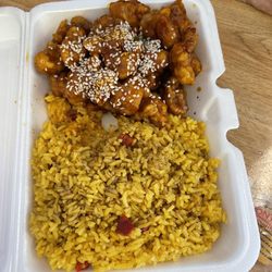 Top's China - Sesame chicken lunch comes with yellow pork fried rice & eggroll $8.25. Was pretty good.