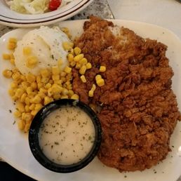 breaded pork, mashed potatoes and corn. breaded pork, mashed potatoes and corn.