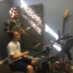 Foothills Music Academy - A Foothills Music Academy teacher working with his drum student.